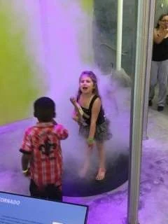 Visitors encountering the interactive tornado