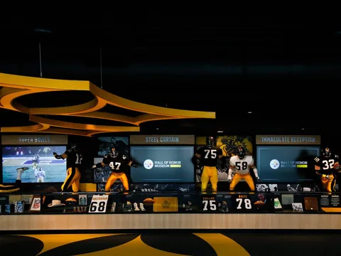 Player displays and screens inside the Pittsburgh Steelers Hall of Honor Museum